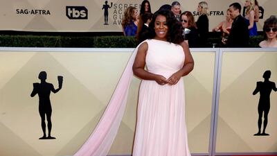 Uzo Aduba looks phenomenal in this beautiful, timeless Christian Siriano dress. Mike Nelson / EPA