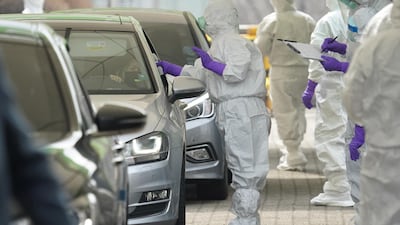 A driver gets a coronavirus test at a drive-through clinic in Seoul. Reuters