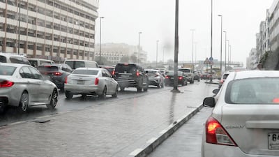 Traffic builds up amid wet weather in Al Karama. Pawan Singh / The National