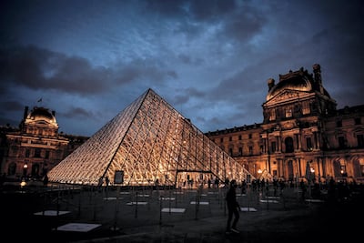 An exterior view of the Musee du Louvre and the Pyramide du Louvre, designed by Ieoh Ming Pei. AFP