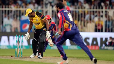 Karachi's Imad Wasim takes the wicket of Peshawar's Kieron Pollard.