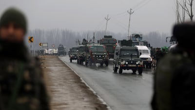 Indian security forces vehicles drive to the site of an attack on a paramilitary Central Reserve Police Force (CRPF) convoy that killed at least 16 troopers and injured several others near Awantipora town, about 30 kms South of Srinagar, in Lethpora. AFP