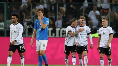 Timo Werner celebrates scoring the fifth goal with teammate David Raum. Getty