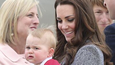 Kate, the Duchess of Cambridge, holds Prince George as they say goodbye before they board their flight in Canberra, Australia. Rob Griffith / AP photo