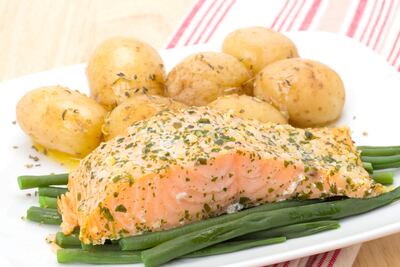 Potatoes in their skins and salmon are good sources of the mineral. Getty