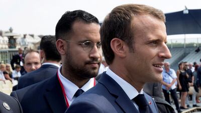 FILE PHOTO: French President Emmanuel Macron walks ahead of his aide Alexandre Benalla at the end of the Bastille Day military parade in Paris, France, July 14, 2018. Picture taken July 14, 2018. REUTERS/Philippe Wojazer/File Photo