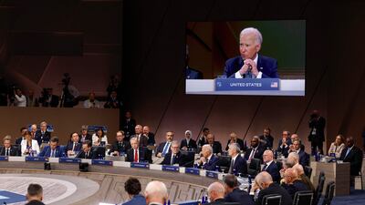 Mr Biden delivers remarks at the summit. Getty Images / AFP