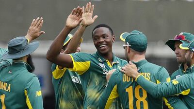 South Africa's bowler Kagiso Rabada, centre, celebrates taking the wicket of England's Adil Rashid during the third One Day International cricket match against England at Lord's. AP Photo
