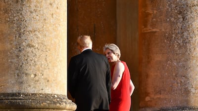 Theresa May and Donald Trump enter Blenheim Palace for a dinner hosted by the British prime minister on the first day of the US president's visit to Britain. Getty Images