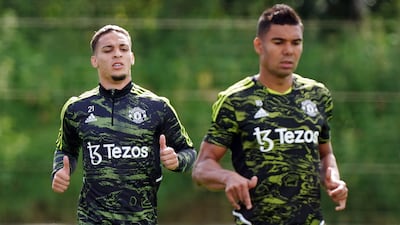 Manchester United's new signings Antony, left, and Casemiro train at Carrington. PA