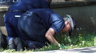 Police officers search for evidence at the scene where a teenager was found after being shot on Saturday, in London, Britain May 6, 2018. REUTERS/Peter Nicholls