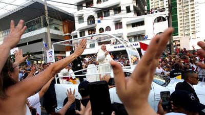 Pope Francis waves from the popemobile as he heads to the Don Bosco Basilica, in Panama City. EPA