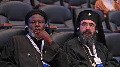Representatives of different faiths attend the conference. AFP