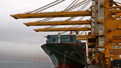 A cargo ship offloads containers at the Jebel Ali port in Dubai. Kamran Jebreili / AP Photo