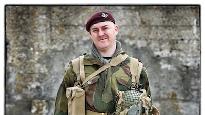 David Cook, from the United Kingdom, wears a replica uniform of member of the British Army Ox and Bucks 6th Airborne Division.