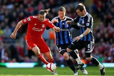 Andy Carroll, left, failed to repeat his Newcastle form at Liverpool. Getty