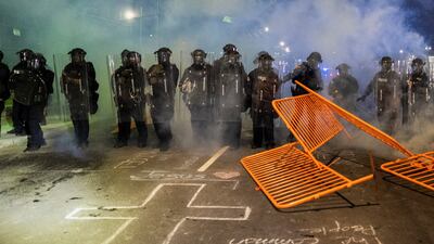 Police use riot gear and deploy tear gas during protests outside Delaney Hall migrant detention centre, in Newark, New Jersey, US. Reuters