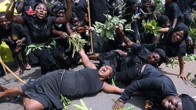 Women carrying branches of mango trees as a symbol of solidarity stage a protest in Abuja on March 11 against sectarian killings.
