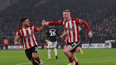 Sheffield United's Oliver McBurnie, right, celebrates after making it 3-3 against Manchester United at Bramall Lane. AFP
