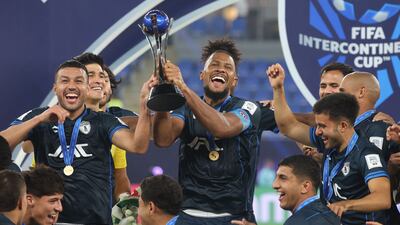 Pachuca's players celebrate with the trophy. AFP