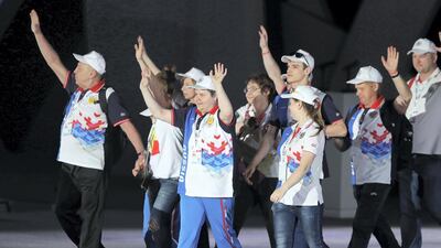 The Russian team wave to the crowd during the Opening Ceremony. Chris Whiteoak / The National