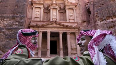 Jordanian royal desert forces stand guard in front of Al Khazneh, Arabic for the Treasury in the ancient city of Petra, Jordan. Tourism in Petra has taken a hit no thanks to regional turbulence and Jordan's high-profile role in the battle against ISIL. Raad Adayleh/AP Photo
