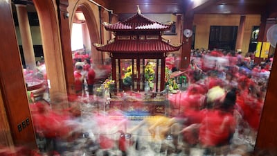Members of the Chinese community offer prayers during Chinese Lunar New Year in Manila, Philippines. Reuters