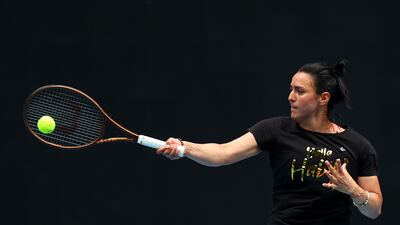 Ons Jabeur plays a forehand during a practice session at Melbourne Park. Getty