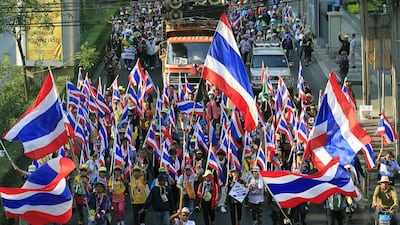 The protesters, above, are minority that cannot win power at the polls. They are demanding the government be replaced by an unelected council that would rewrite political and electoral laws to combat deep-seated problems of corruption and money politics. EPA