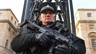 A heavily armed police officer stands guard in London, Britain, on December 20, 2016. Several European countries hae beefed up security following the attack on the Christmas market in Berlin. Andy Rain / EPA