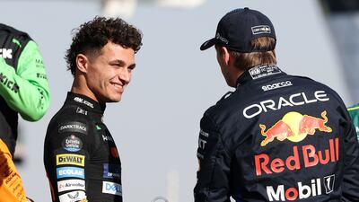 McLaren driver Lando Norris chats with Red Bull Racing driver Max Verstappen.