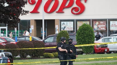 Police secure the area around the Buffalo supermarket where the shooting took place. AP