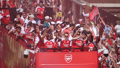 Arsenal's Viktor Gyokeres, Noni Madueke, Bukayo Saka with the Premier League trophy during the victory parade. Reuters