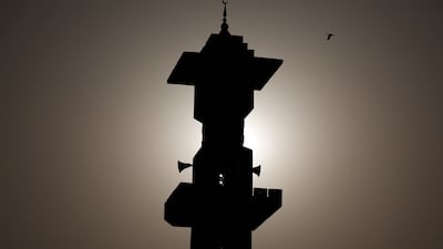 Dust fills the sky above Al Emam Al Tabarani Mosque in Sharjah. Chris Whiteoak / The National