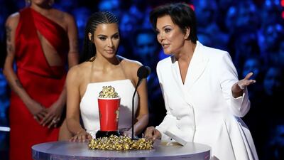 Kim Kardashian West, left, and Kris Jenner accept the best reality series award for 'Keeping Up With The Kardashians' AP