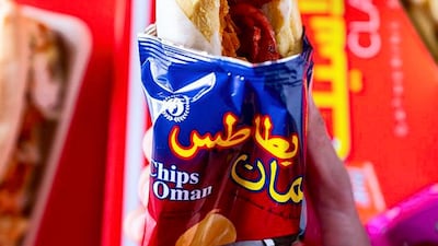 The hotdog fareej from Burger28 is served in a Chips Oman wrapper. Courtesy Burger28