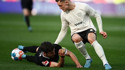 Jonas Hector of FC Koln is challenged by Florian Wirtz of Bayer Leverkusen during the Bundesliga match on March 13, 2022 in Leverkusen, Germany. Getty