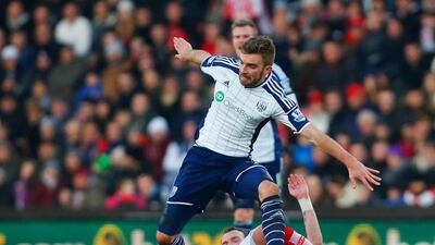 James Morrison of West Bromwich Albion is tackled by Glenn Whelan of Stoke City at Britannia Stadium. Paul Thomas / Getty Images