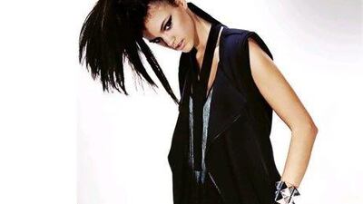 Dress (worn as sleeveless jacket), Rad Hourani. Top; skirt, both Zara. Cuff, Tom Binns.