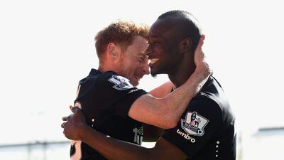 Dame N'Doye of Hull City celebrates scoring on Saturday with Stephen Quinn during their Premier League victory against Crystal Palace. Christopher Lee / Getty Images