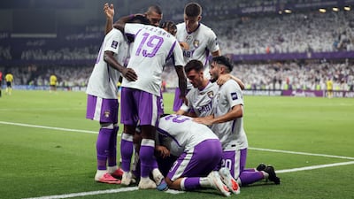 Houssine Rahimi celebrates with his Al Ain teammates after scoring. Chris Whiteoak / The National