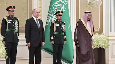 Mr. Putin and King Salman attend a welcome ceremony at the Saudi Royal palace. EPA