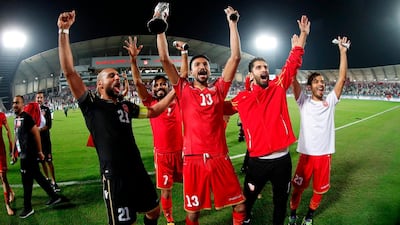 Bahrain players celebrate. AFP