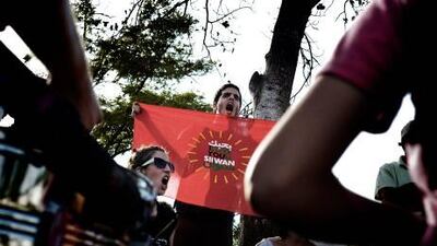 Palestinian, foreign and Israeli activists take part in a weekly demonstration against settlements in the mostly Arab East Jerusalem neighbourhood of Sheikh Jarrah on September 24, 2010. The United States called on Israeli Prime Minister Benjamin Netanyahu to prove his commitment to a Palestinian state, warning that prolonged conflict only strengthened extremists. AFP PHOTO/ALESSIO ROMENZI *** Local Caption *** 258819-01-08.jpg
