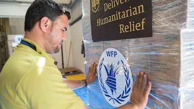 The World Food Programme loads trucks with food and supplies in response to the drought in Somalia at the International Humanitarian City Warehouses in Dubai. Antonie Robertson / The National