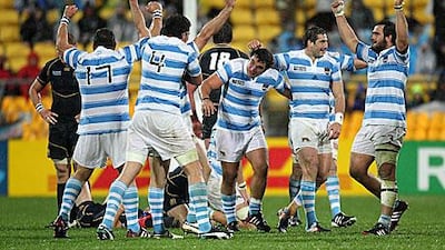 Argentina players celebrate at full time after narrowly beating Scotland 13-12 in Pool B of the Rugby World Cup which boosts their chances of reaching the last-eight.