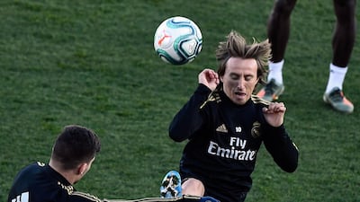 Real Madrid midfielder Luka Modric, right, during training. AFP