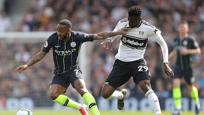 Raheem Sterling of Manchester City is challenged by Andre-Frank Zambo Anguissa of Fulham. Getty Images