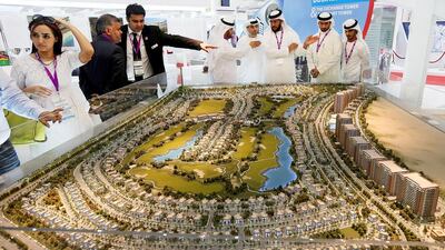 Visitors view the new Living Legends projects of Tanmiyat. Satish Kumar / The National