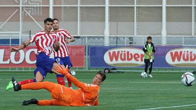 Alvaro Morata of Atletico Madrid scores the opening goal in a friendly against Juventus in Turin on August 7, 2022. EPA